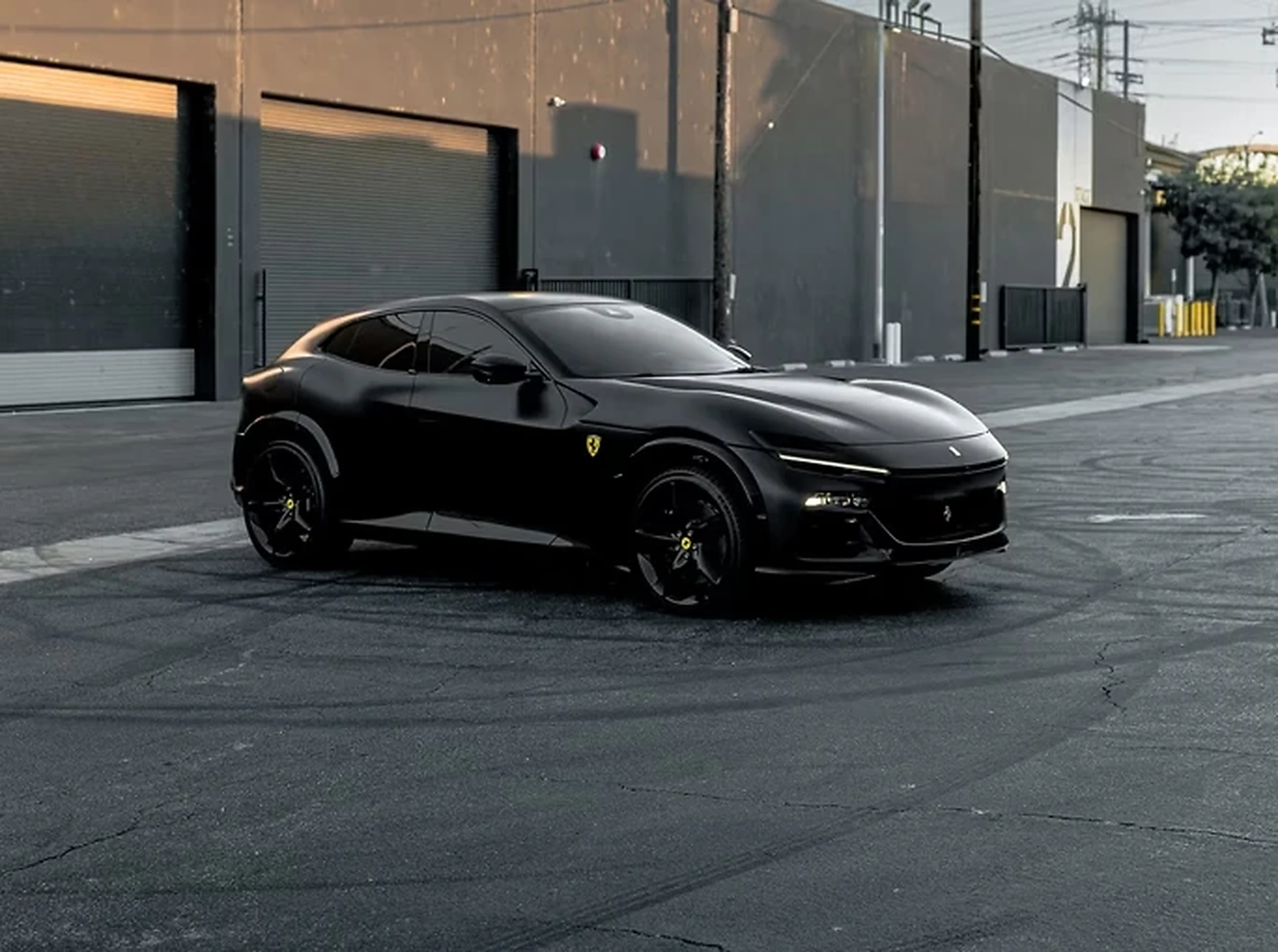 Black Ferrari Purosangue front three-quarter view